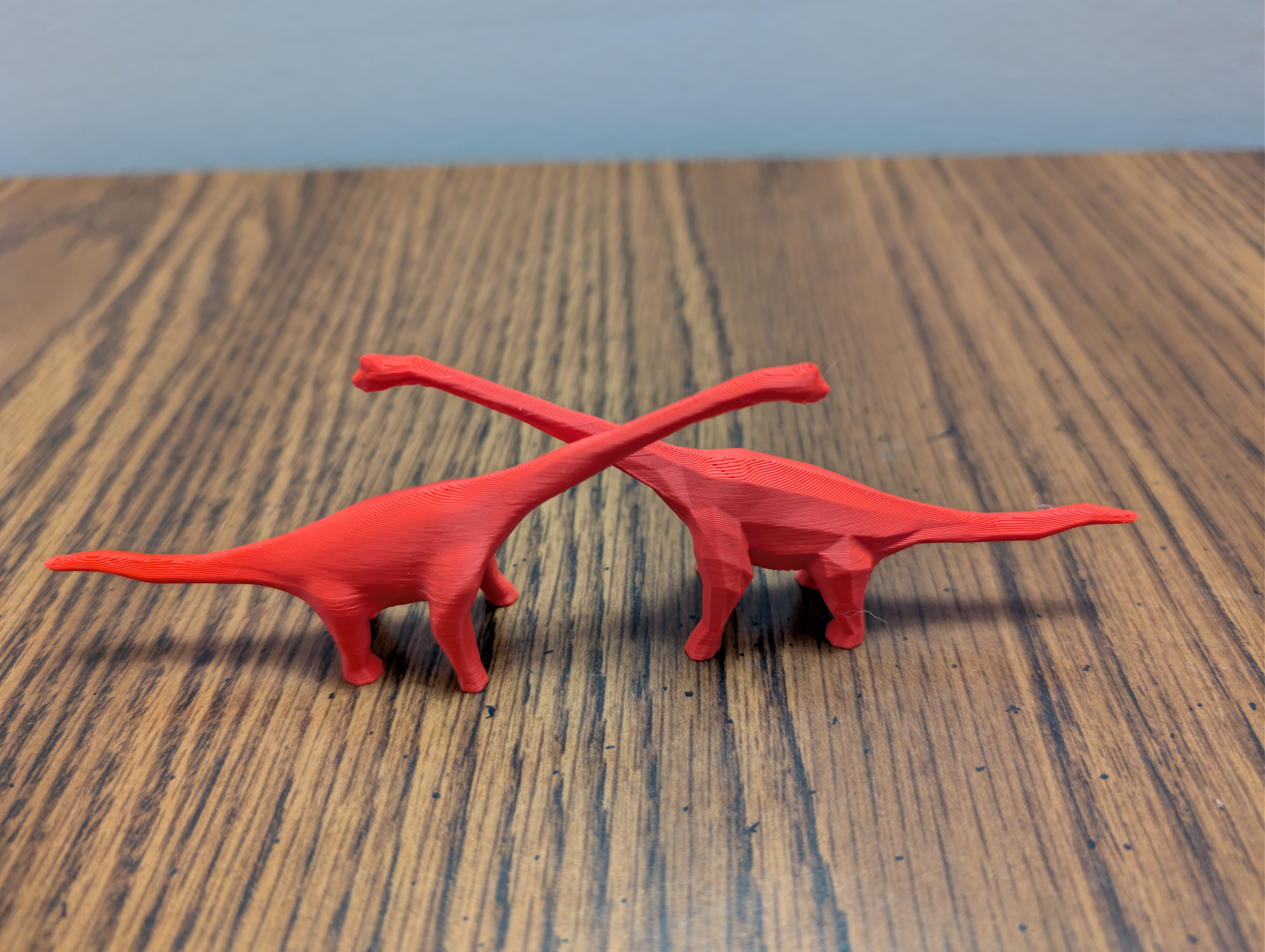 Two dinos crossing necks